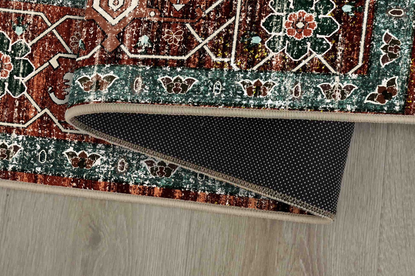 Horizon Copper Medallion rug corner folded, showing the non-slip dot backing
