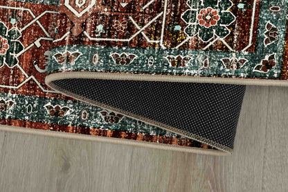 Horizon Copper Medallion rug corner folded, showing the non-slip dot backing
