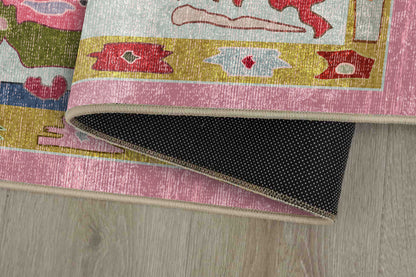 Horizon Pink Oushak rug corner folded, showing the non-slip dot backing