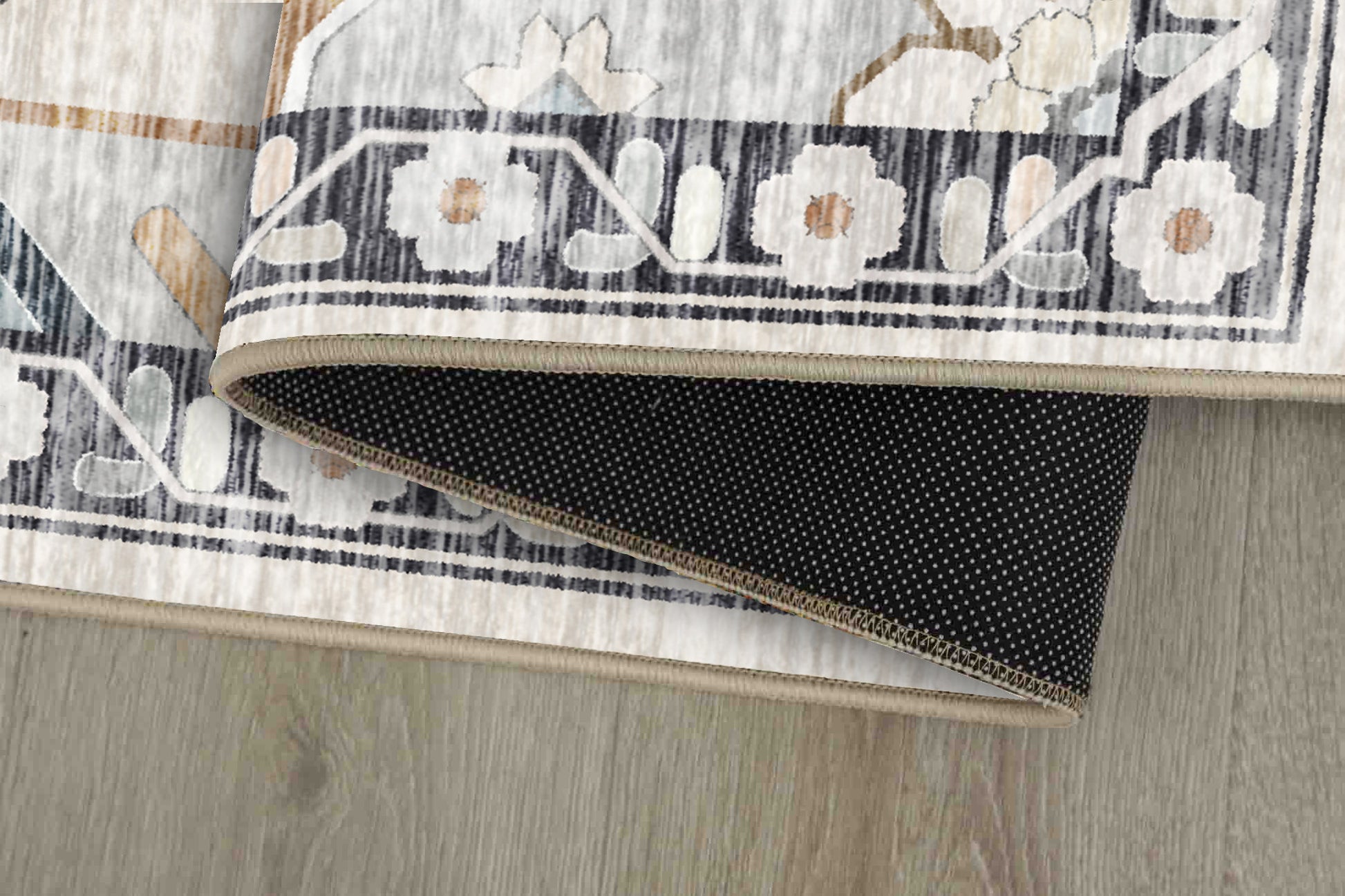 Horizon Soft Medallion rug corner folded, showing the non-slip dot backing