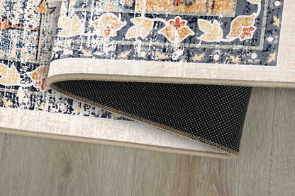 Sabrina Vintage Medallion rug corner folded, showing the non-slip dot backing