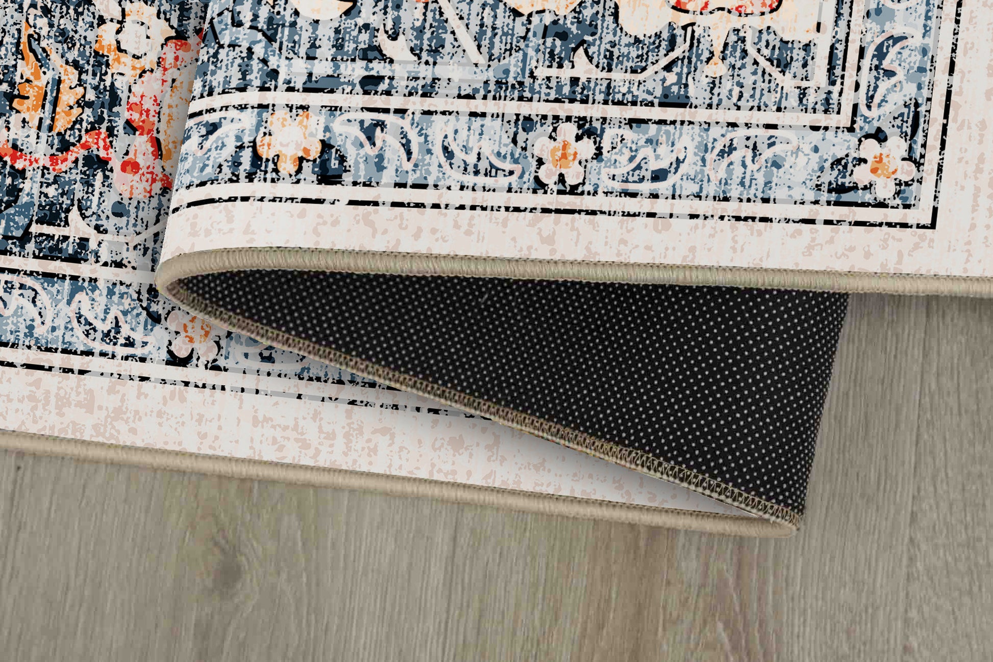 Sabrina Coral Medallion rug corner folded, showing the non-slip dot backing