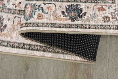Sabrina Teal Trellis rug corner folded, showing the non-slip dot backing