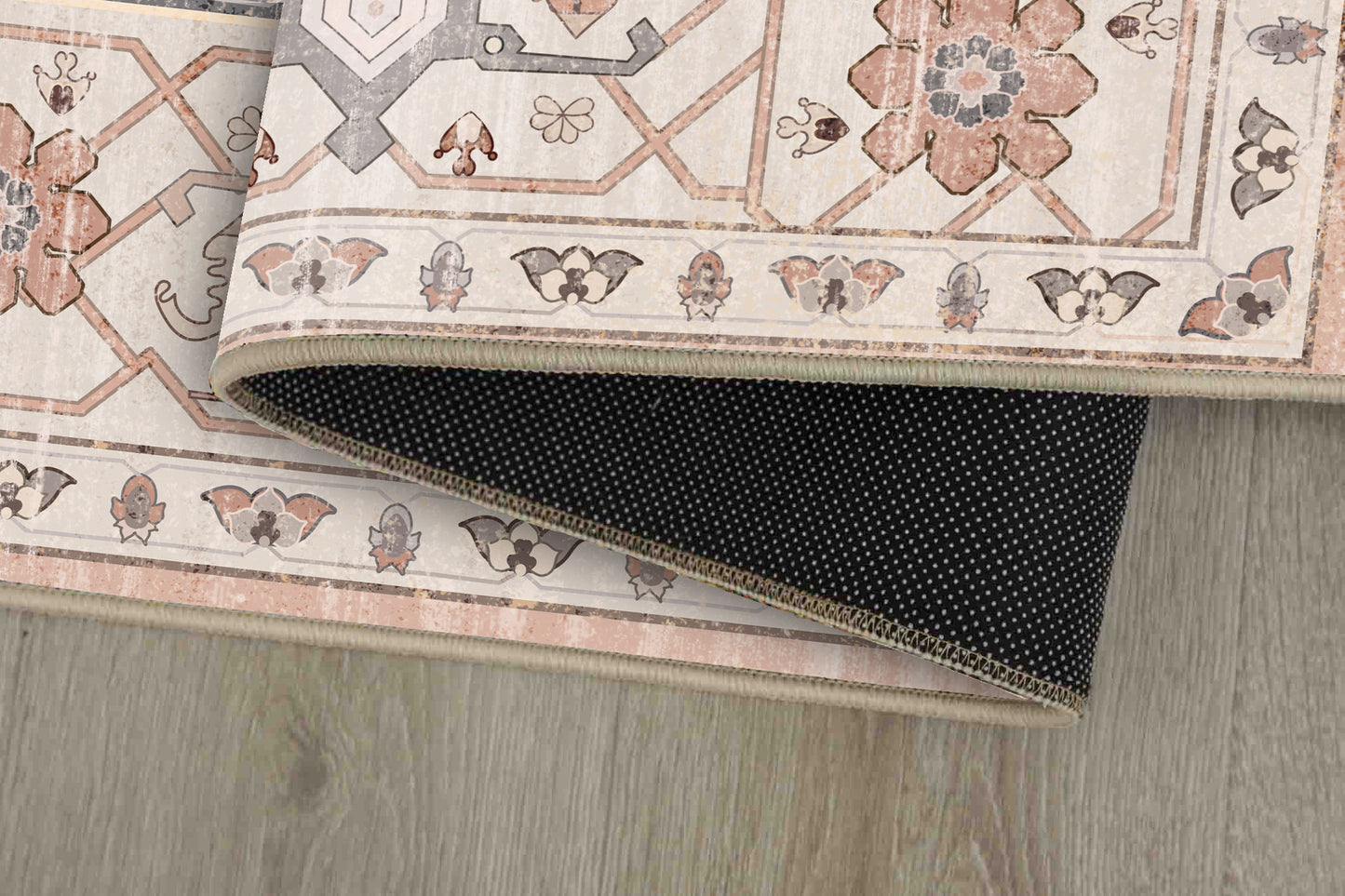 Sabrina Blush Medallion rug corner folded, showing the non-slip dot backing