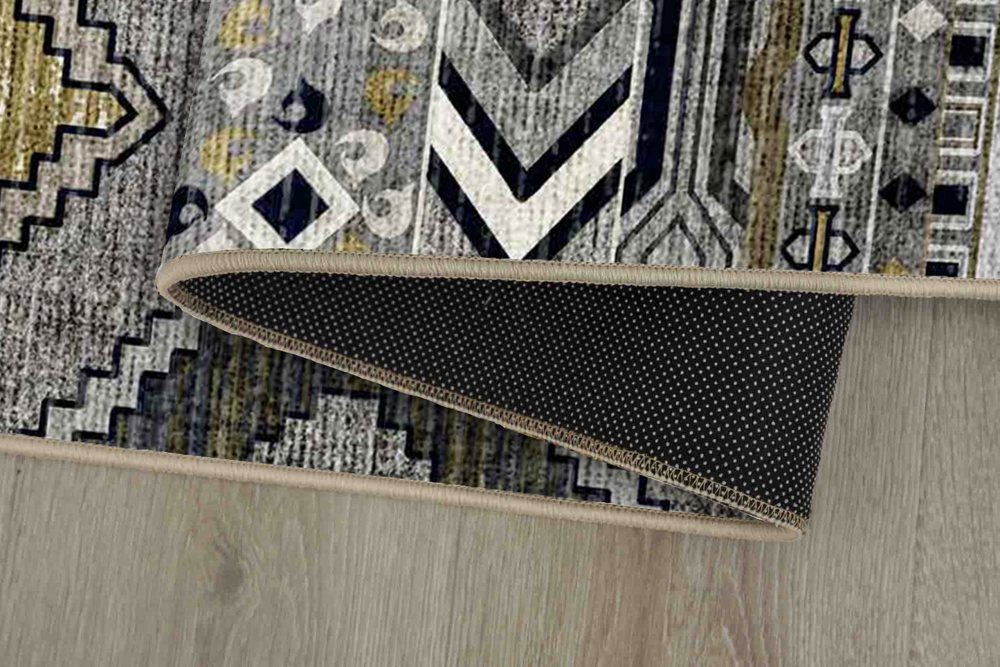Tello Tribal Bands rug corner folded, showing the non-slip dot backing
