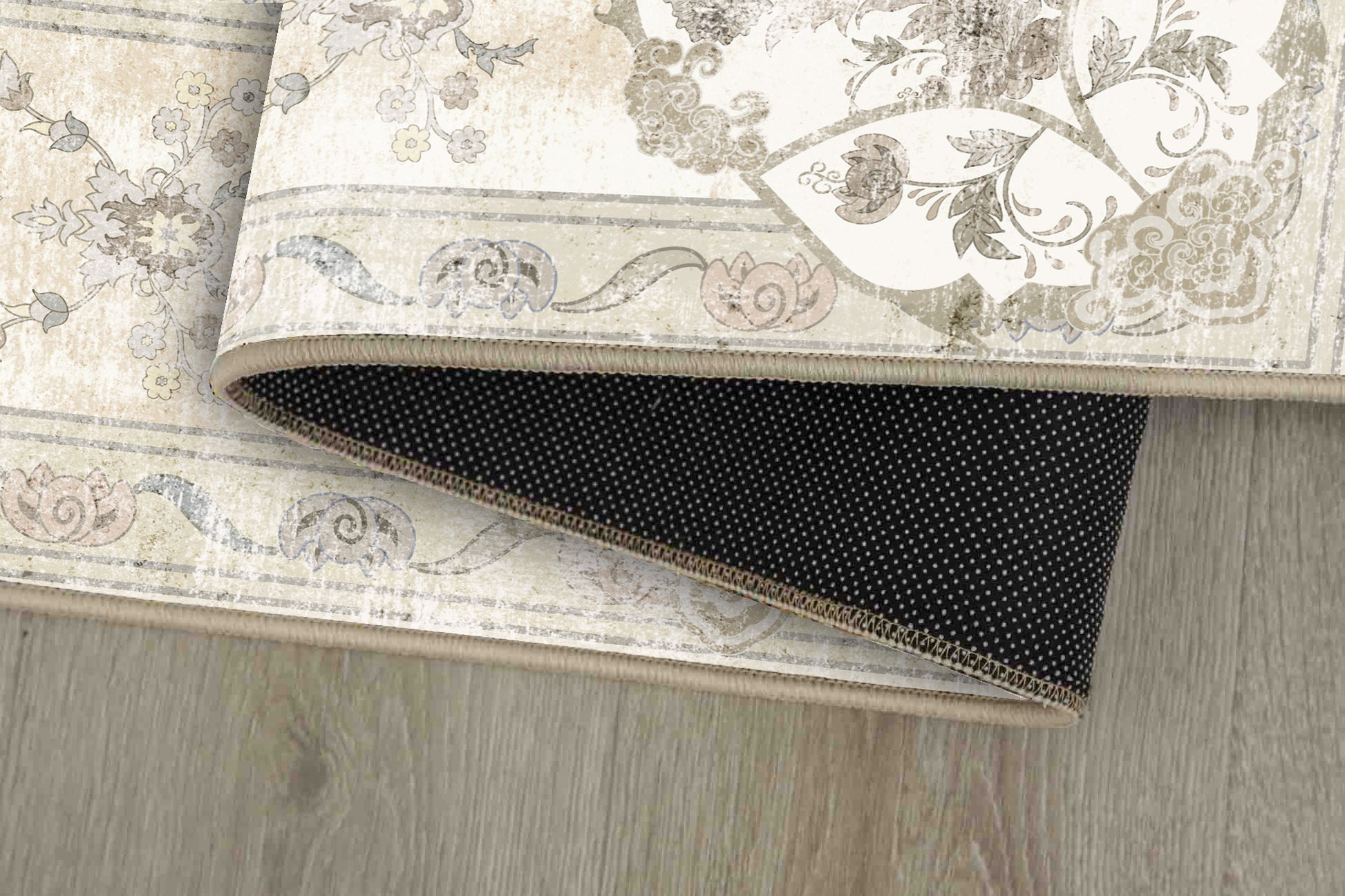 Tello Whisper Ivory rug corner folded, showing the non-slip dot backing
