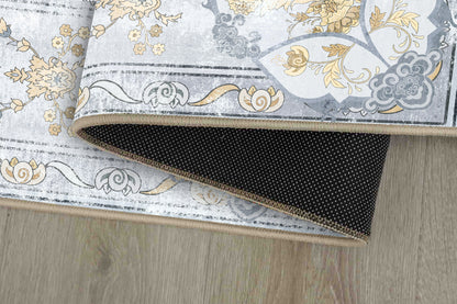 Tello Whisper Blue rug corner folded, showing the non-slip dot backing