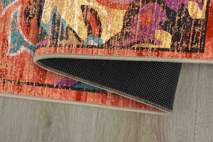 Tello Bohemian Sunset rug corner folded, showing the non-slip dot backing
