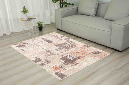 Torino Abstract Terracotta rug in a living room