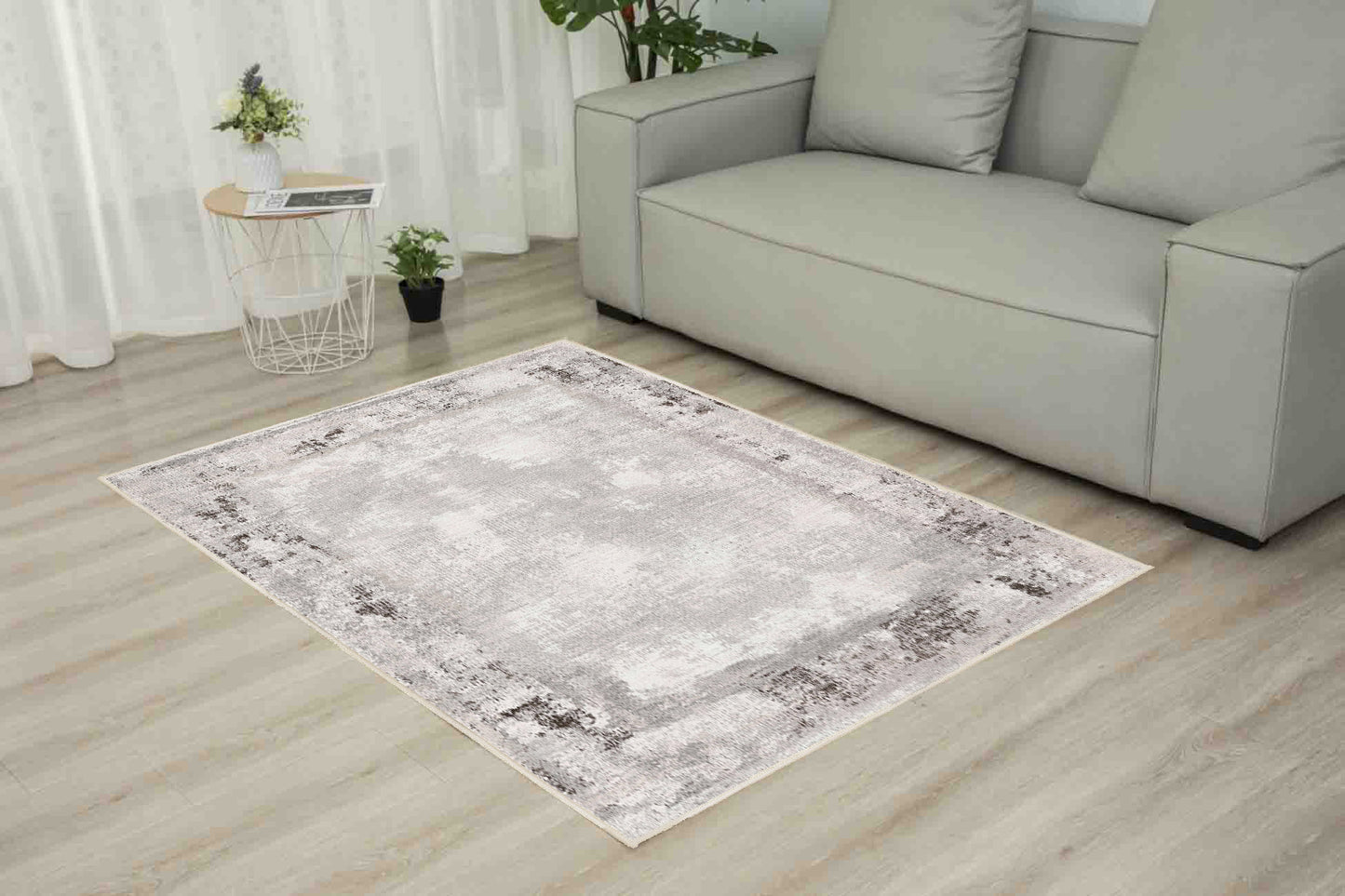 Torino Stone Border rug in a living room